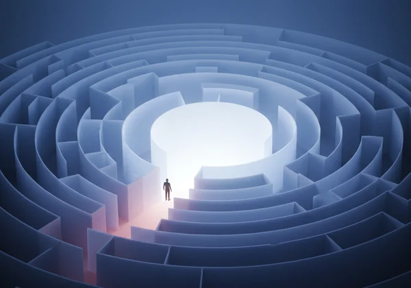 Person navigating a maze towards a light, symbolizing clarity.