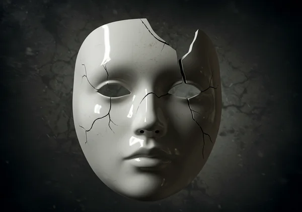 A cracked mask, symbolizing a moment of self-awareness or crisis